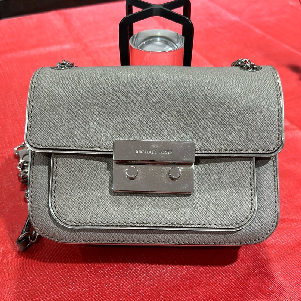 Used gray and silver Michael Kors crossbody